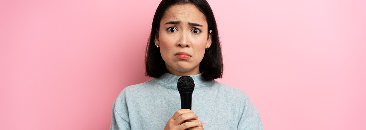 Anxious woman holding a microphone